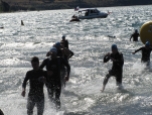 Pic two is of the same group of men exiting the water after the 750m swim in rough conditions. Jeno is second on the left, in blue cap and goggles. Marjorie